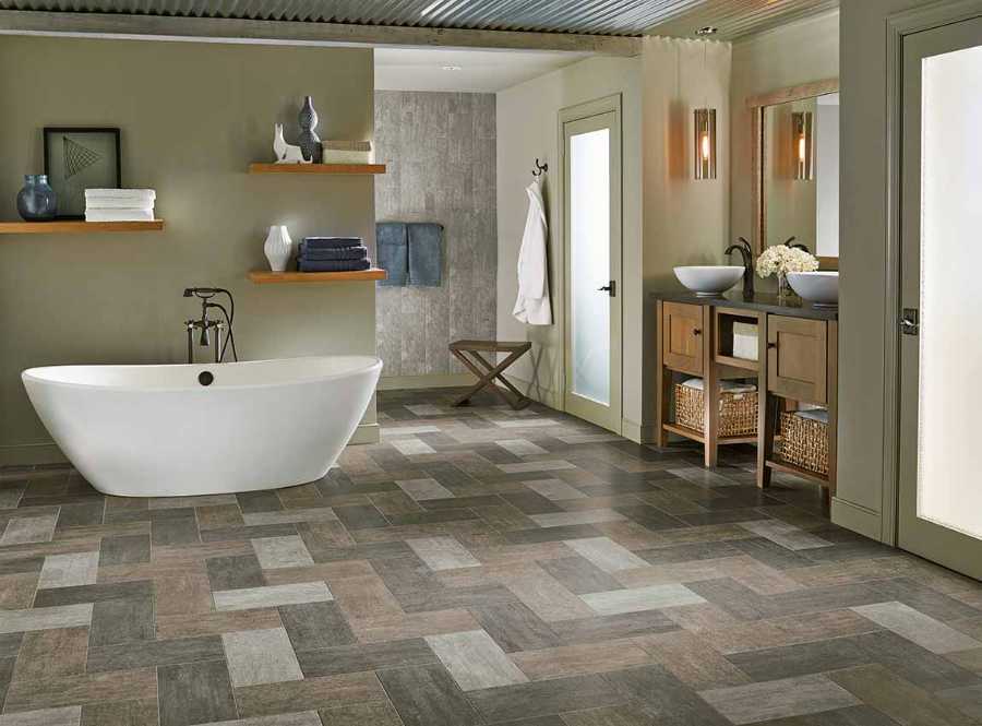 transitional bathroom with wood look tile floor and soaking tub